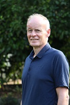 Image of a white man in a garden