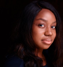 Image of a Black woman with long, dark hair