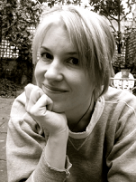 Black and white image of a white woman in a garden