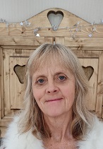 Image of a white woman's head against wood