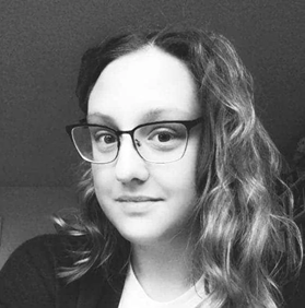Black and white headshot of a white woman with glasses