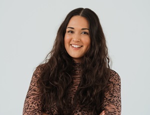 Headshot of a woman with long brown hair