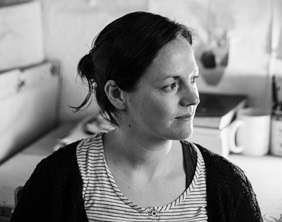 Black and white image of a white woman looking a