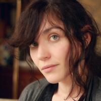 Headshot of a white woman with brown hair