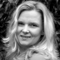 Greyscale headshot of a white woman with pale hair