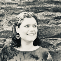 Greyscale headshot of a white woman