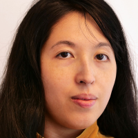 Headshot of a woman with long dark hair