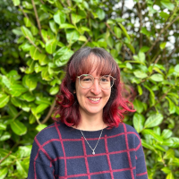 Photo of a woman with red hair outside