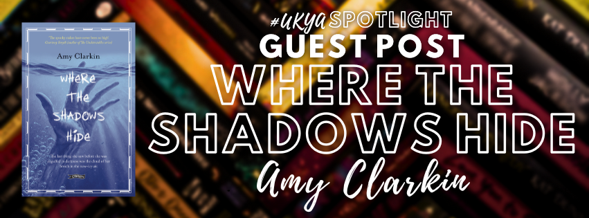 Title in white on black, red, and gold blurred rectangles next to image of pale blue book