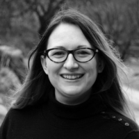 Black and white headshot of a white woman outside