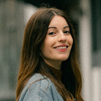 Headshot of a white woman with long brown hair