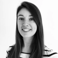 Black and white headshot of a white woman with long dark hair