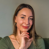 Headshot of a white woman with light brown hair inside