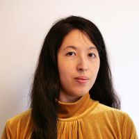 Headshot of a woman with long dark hair