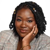 Headshot of a Black woman in a grey suit