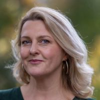 Headshot of a white woman outside