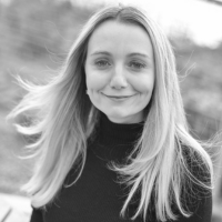 Black and white headshot of a white woman with long blonde hair